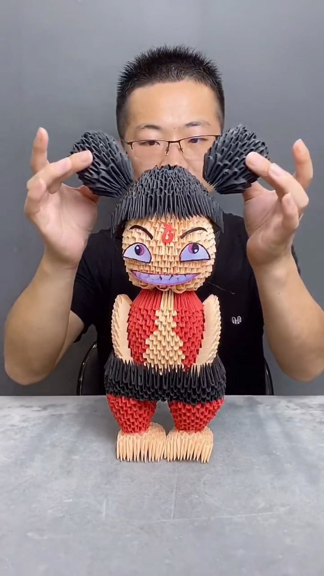 手工制作#纯手工三角折纸作品哪吒,帮忙看看像吗